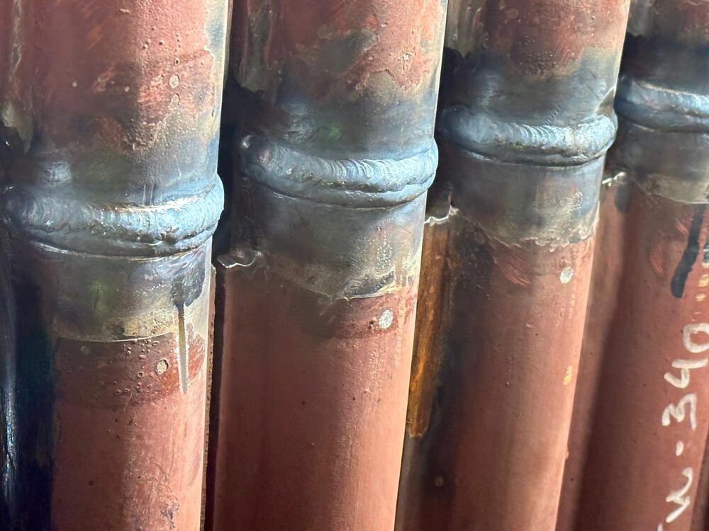 Close-up of a welded repair on stainless steel pipework
